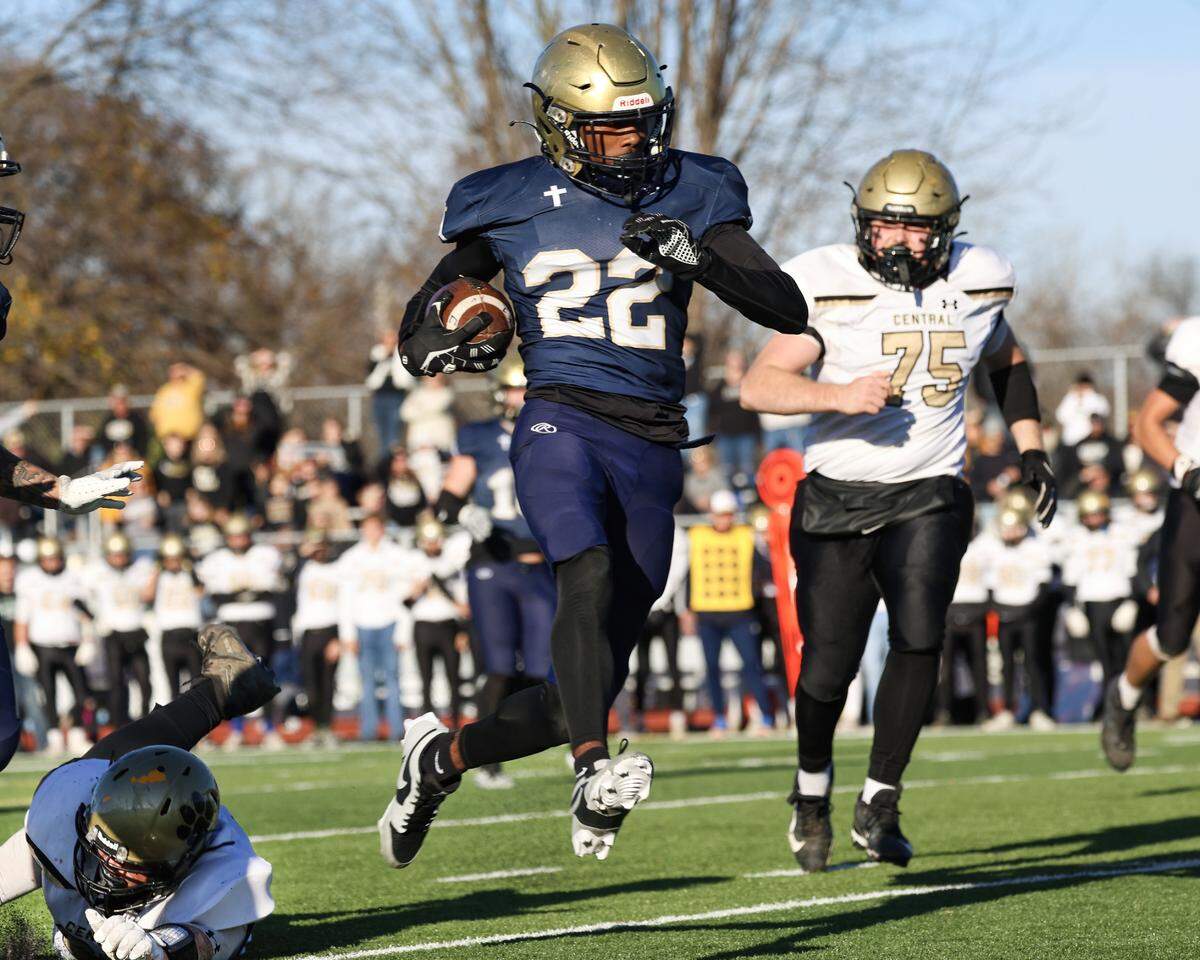 Althoff defensive back Lorne Green returns an interception during Saturday’s IHSA Class 1A semifinal game against Camp Point Central. The 58-19 win advances the Crusaders to the championship game Friday at Illinois State University where they will face Lena-Winslow.