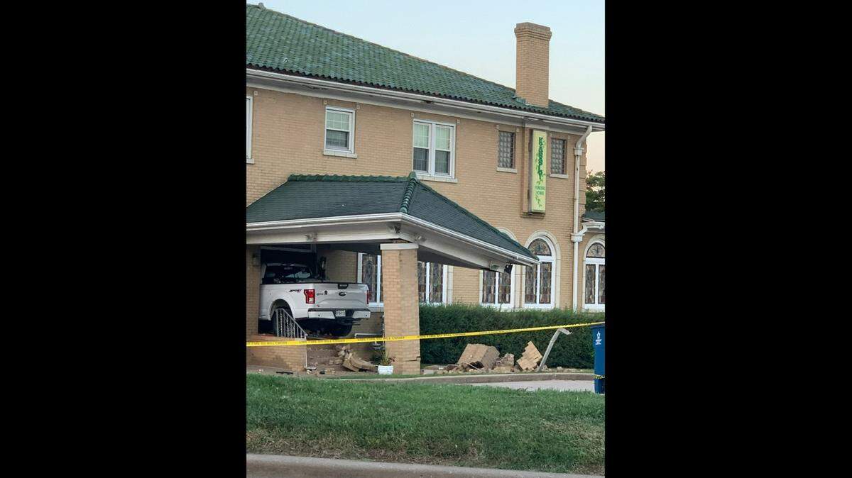 A white Ford truck that crashed into Kassly-Meridith Funeral Home in Collinsville on Aug. 22, 2021, remained lodged in the side of the building for two days.