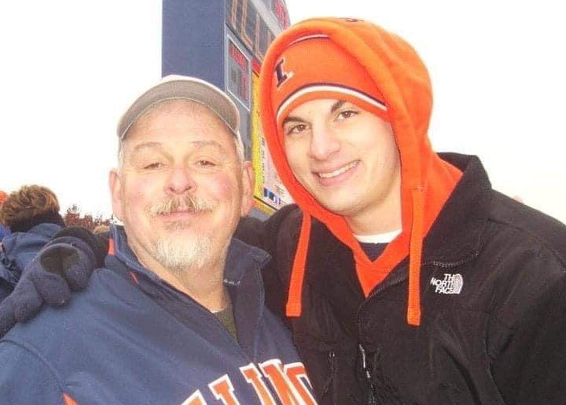 Dan Manoyan, left, a retired sportswriter and author of the book “Men of Granite,” and his son, Randall Manoyan, show their support for the University of Illinois. Dan died last year.