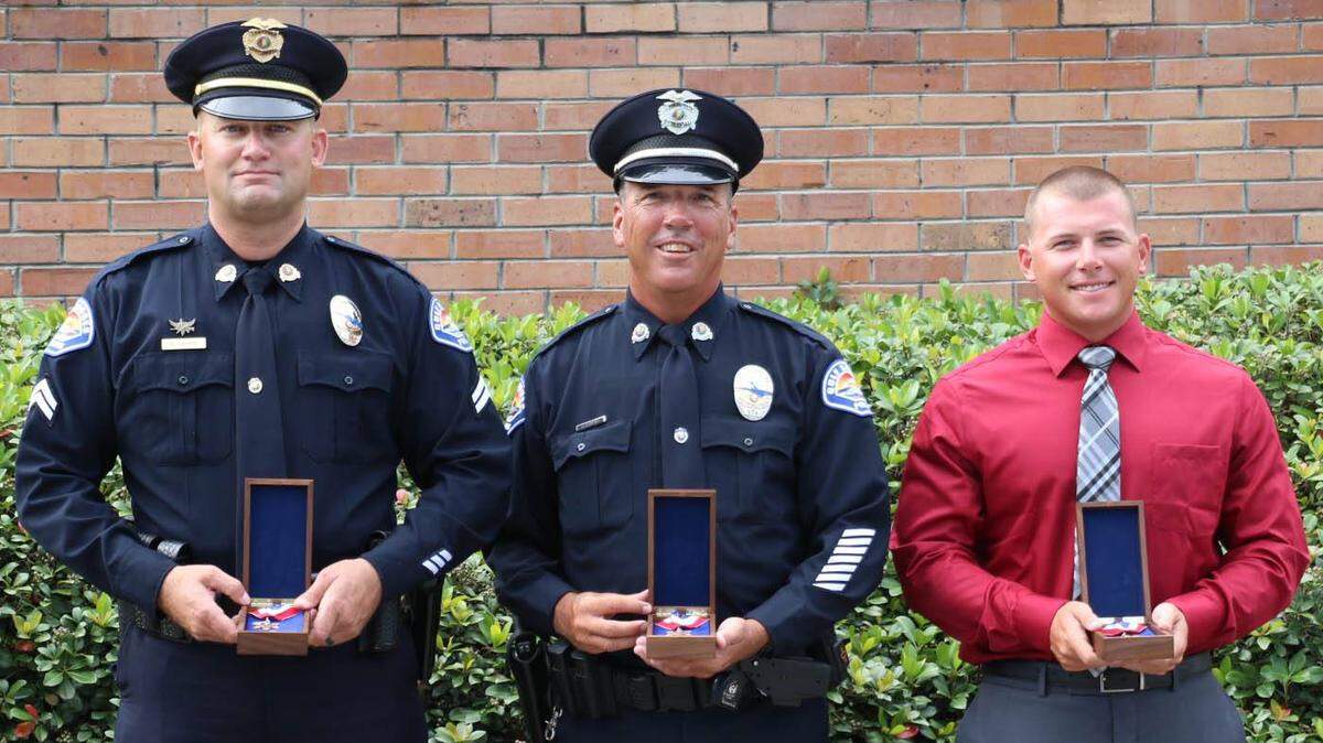 Gulf Shores, Ala., Police Department Cpl. Nathaniel Harris, Patrolman Michael Hoguet and Beach Enforcement Officer Brandon Hoguet received a life-saving award for saving a woman pulled from the Gulf of Mexico on June 18. Harris and Michael Hoguet previously served with the Fairview Heights Police Department.