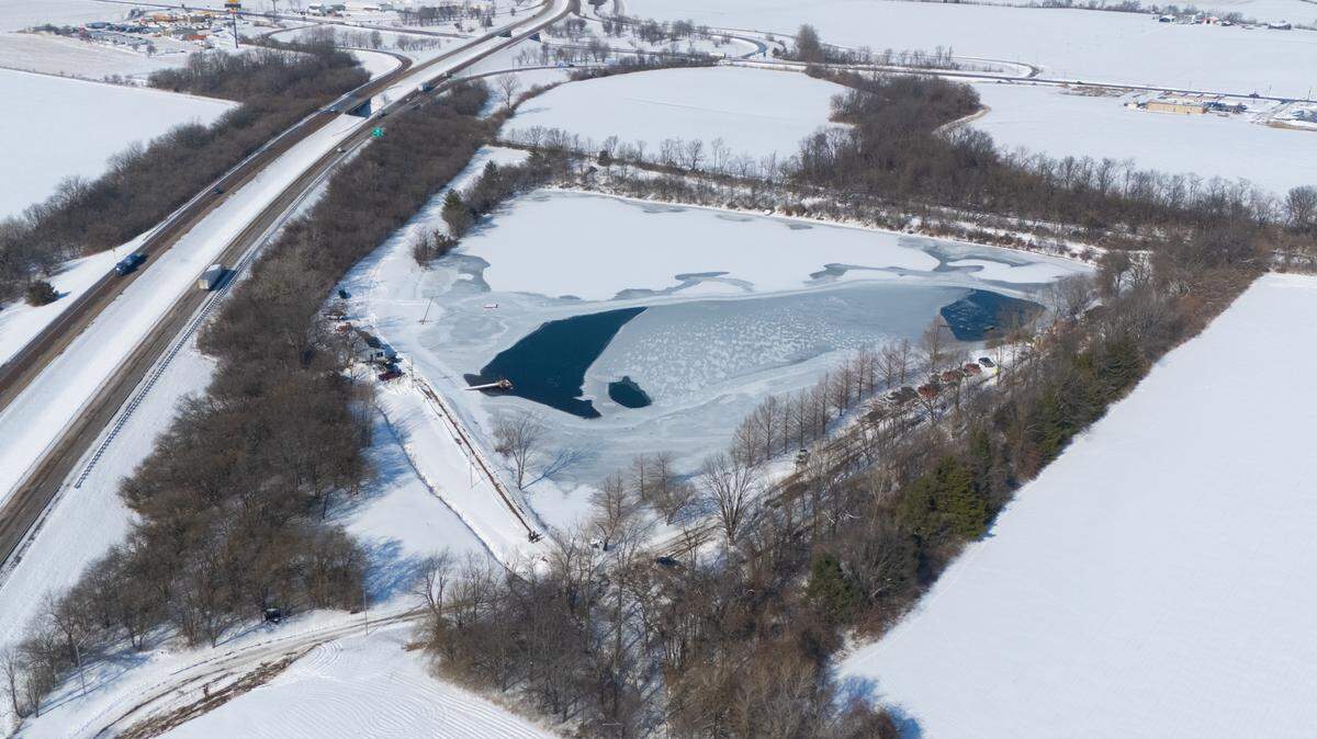 A drone photo shows a pond off Renth Road near Interstate 64 south of New Baden on Tuesday. Authorities are searching for a 23-year-old waterfowl hunter who broke through the ice on the pond and did not resurface on Monday. His body was found Tuesday.
