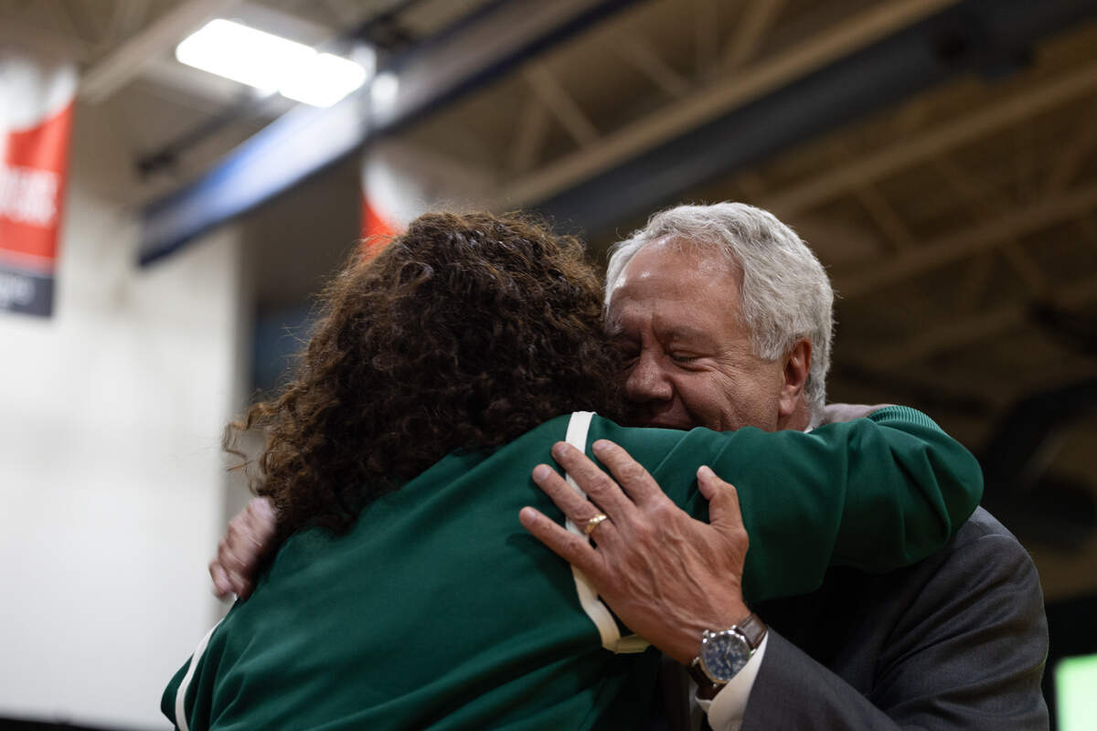 Illinois State Senator Jay Hoffman and olympian and philanthropist Jackie Joyner-Kersee share and embrace during the opening of the new Jackie Joyner-Kersee Food, Agriculture, and Nutrition Innovation Center in East St. Louis.