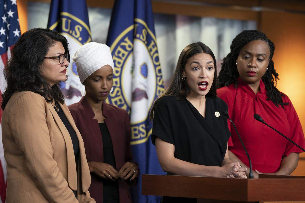U.S. Rep. Alexandria Ocasio-Cortez, D-N.Y., speaks as, from left, Rep. Rashida Tlaib, D-Mich., Rep. Ilhan Omar, D-Minn., and Rep. Ayanna Pressley, D-Mass., listen during a news conference at the Capitol in Washington, Monday, July 15, 2019. President Donald Trump on Monday intensified his incendiary comments about the four Democratic congresswomen of color, urging them to get out if they don’t like things going on in America. They fired back at what they called his “xenophobic bigoted remarks” and said it was time for impeachment. (AP Photo/J. Scott Applewhite)
