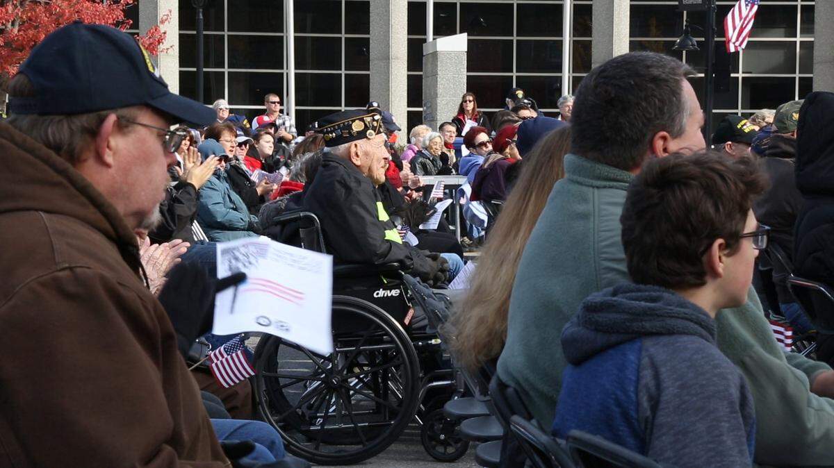 Belleville will hold its 20th Annual Veterans Day Ceremony on Sunday at the Veterans Memorial Monument in Downtown Belleville.  Above, a retired military veteran watches the ceremony at last year’s event.