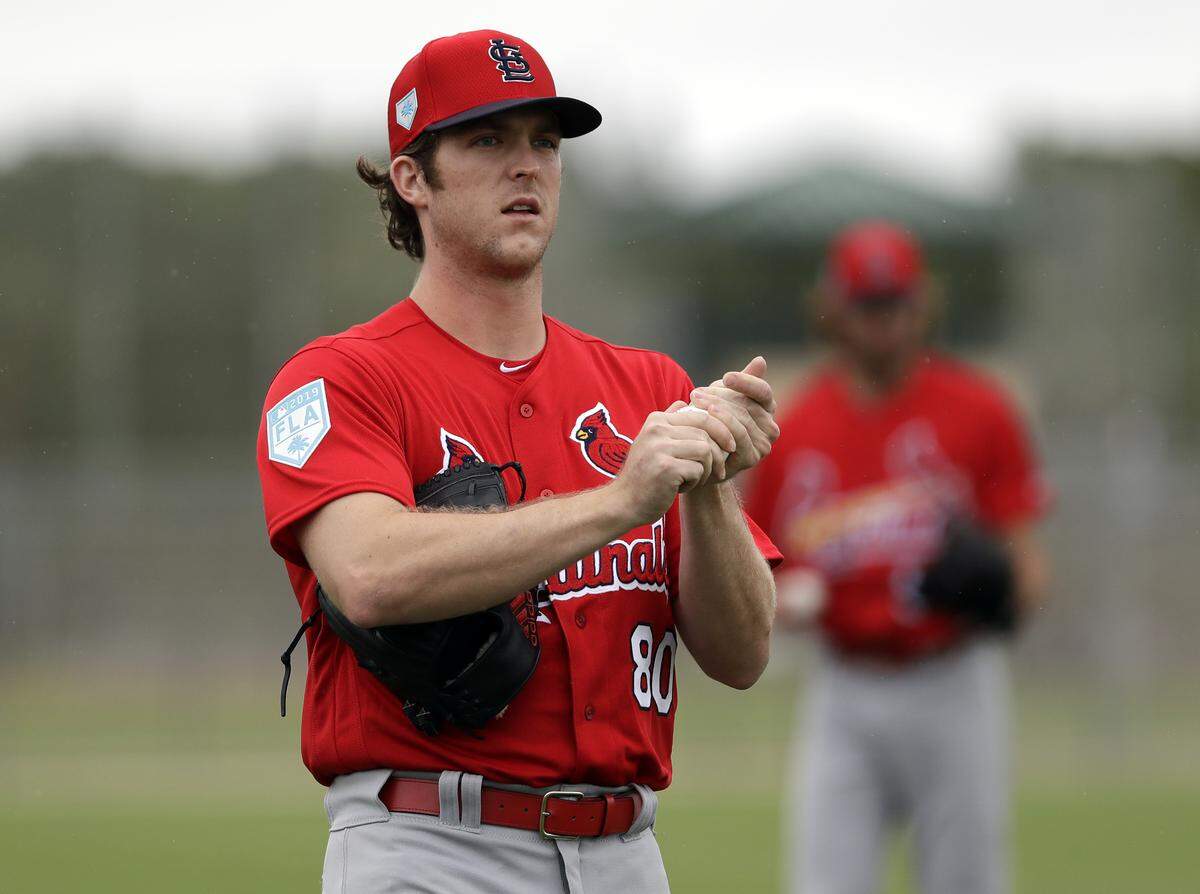 St. Louis Cardinals pitcher Jake Woodford rubs up a ball during spring training in 2019 in Jupiter, Florida. Woodford is one of the Redbirds hurlers hoping to benefit from the team’s focus on pitch design. Woodford described the approach as, “Small tweaks. Not reinventing the pitch or anything.”