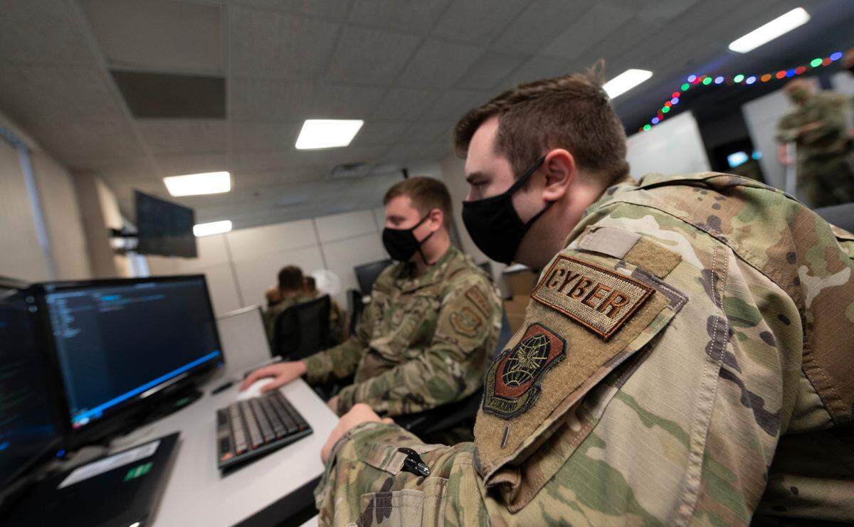 U.S. Air Force Senior Airman William J. Hartzel Jr., 375th Communications Support Squadron applications designer platform engineer, looks over his work on an application his team is building on Scott Air Force Base. The 375th CSPTS focuses on digital solutions to automate and improve processes for Airmen across the Air Force.