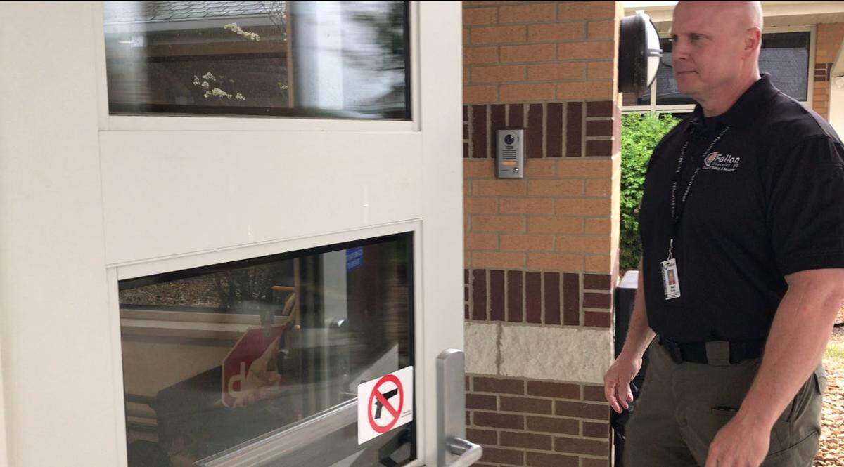 O'Fallon School District 90 Safety and Security Director Mark Berry gets 'buzzed' in by school office staff after ringing the security doorbell that's part of the main entrance exterior wall surveillance system at Delores Moye at 1010 Moye School Rd. in O'Fallon. All seven district schools currently have this feature.