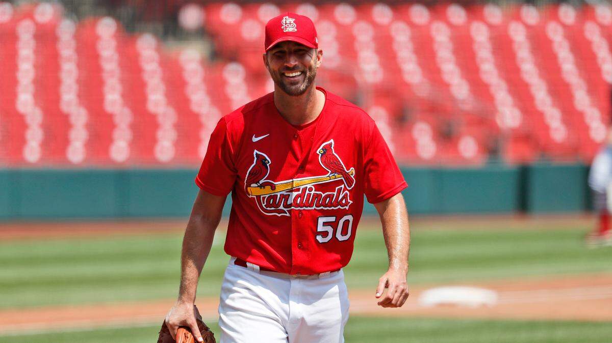 FILE - St. Louis Cardinals pitcher Adam Wainwright smiles after throwing a simulated inning during baseball practice at Busch Stadium in St. Louis, July 5, 2020, file photo.