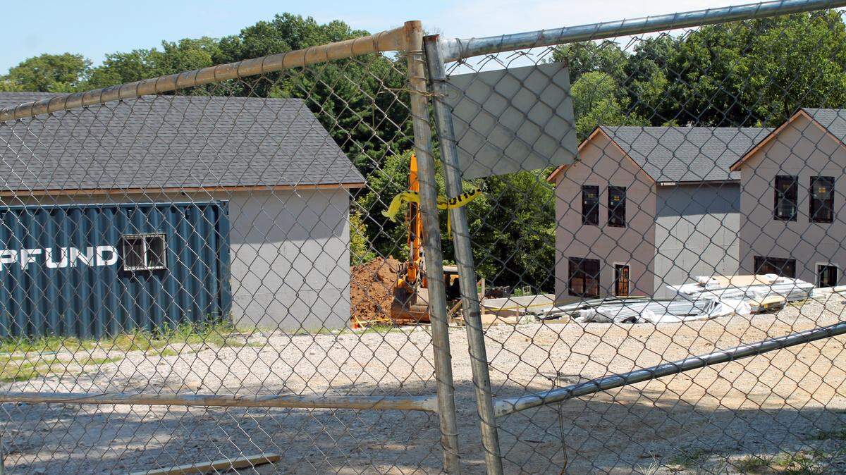 Authorities say two men died and a police officer was injured Friday, Aug. 19, 2022, at a construction site in the 100 block of Union Street in Edwardsville, which is the location of the new Pfarm home development by Pfund Construction. The site is pictured here on Saturday.