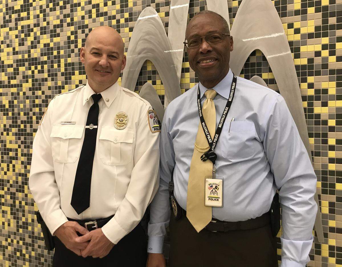 Assistant Police Chief Matt Eiskant, left, poses for photos with Police Chief Bill Clay at Belleville City Hall after a City Council meeting on Monday night. Aldermen appointed Clay as the city’s human resources director and Eiskant as the new police chief.