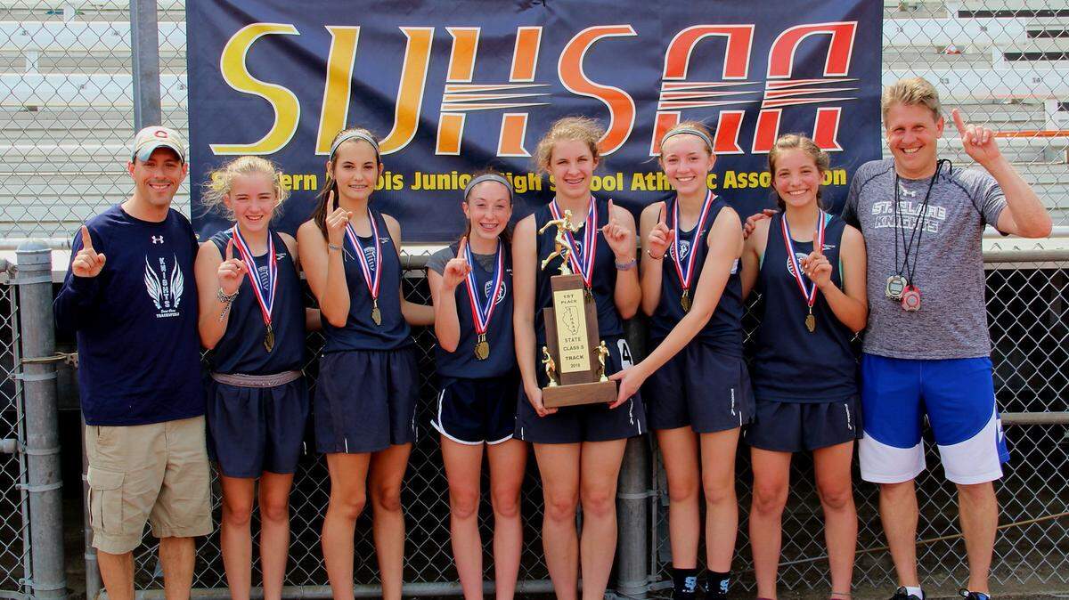 From left are St. Clare track coach Tom Fischer, Cami Crouch, Tia Golder, Maddie Schillinger, Caitlin Conrad, Katelyn Knaust, Sophie Ryan and coach Mark Somraty.