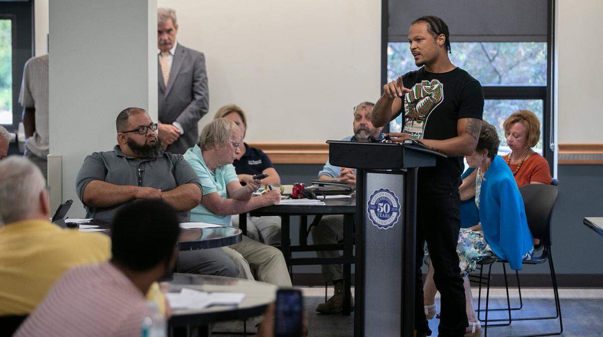 Activist J.D. Dixon addresses members of the Fairview Heights city council in response to the actions of a police officer that broke up a fight at the Sky Zone indoor trampoline park.