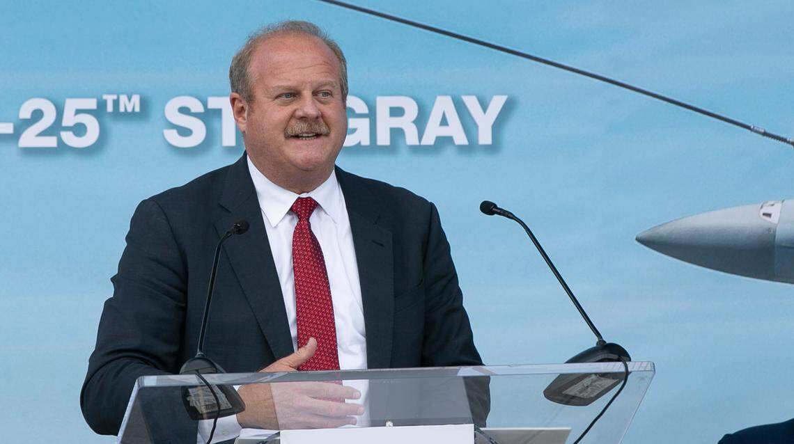 St. Clair County Board Chairman Mark Kern praises Illinois Gov. J.B. Pritzker for bringing jobs to southern Illinois while speaking at a news conference Sept. 17 at MidAmerica St. Louis Airport in Mascoutah.