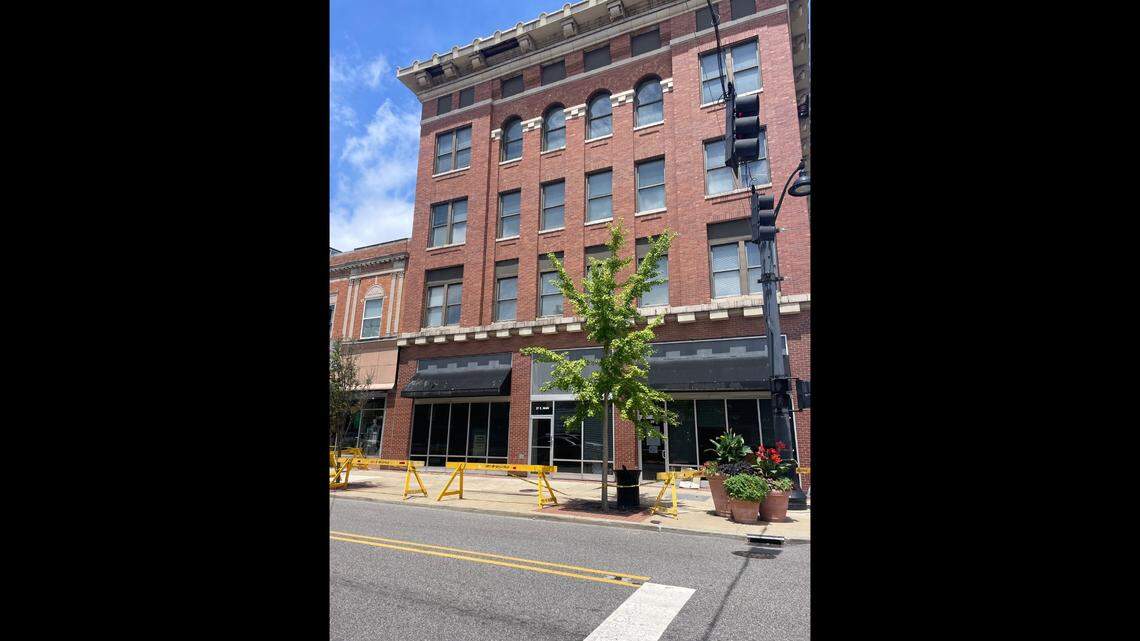 The sidewalk in front of the Market Square Building in downtown Belleville has been barricaded because a piece of the building’s roof overhang fell off.