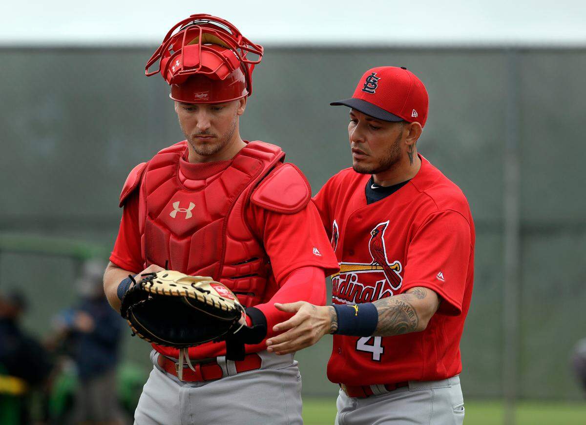 Yadier Molina, right, has signed on as a special assistant for the Cardinals with speculation he’ll someday be the team’s manager.