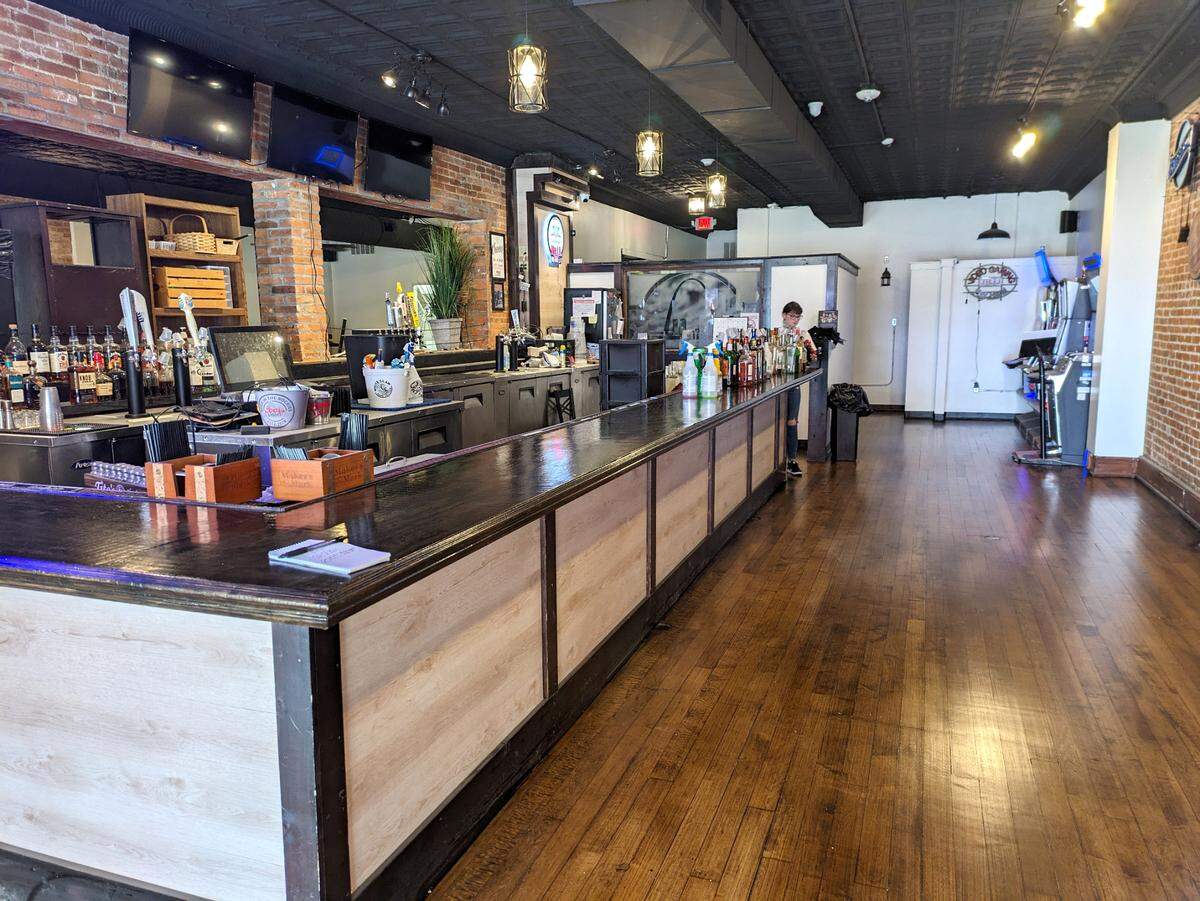 The bar at Lexi’s is unchanged, but the floor was sanded and varnished and ceiling painted black.