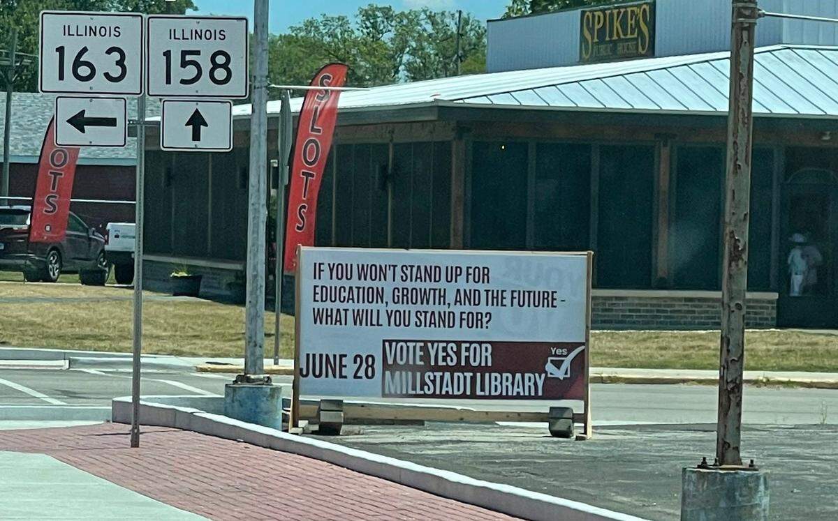 A campaign sign for Millstadt Library District expansion asks, “If you won’t stand up for education, growth, and the future - what will you stand for?”