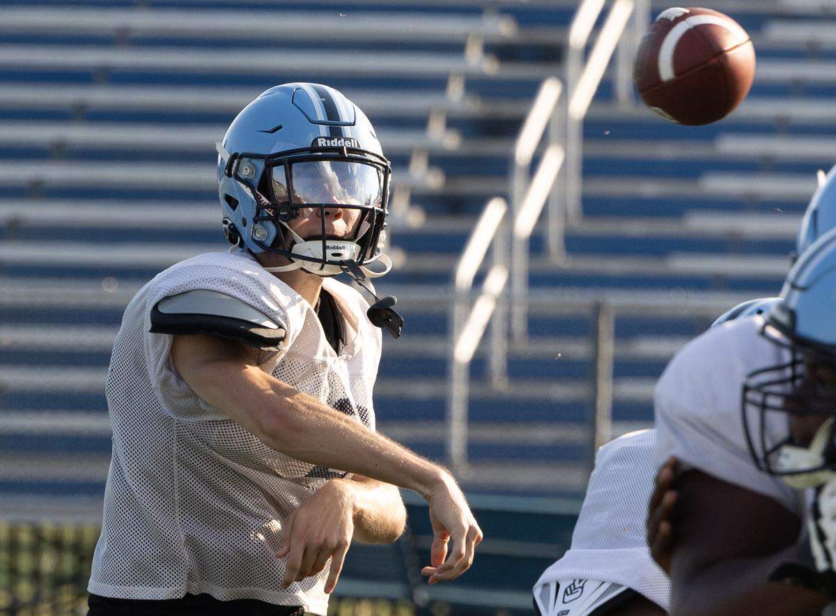 Belleville East quarterback Kayden Wood practices passes in preparation for the first game of the 2025 season.