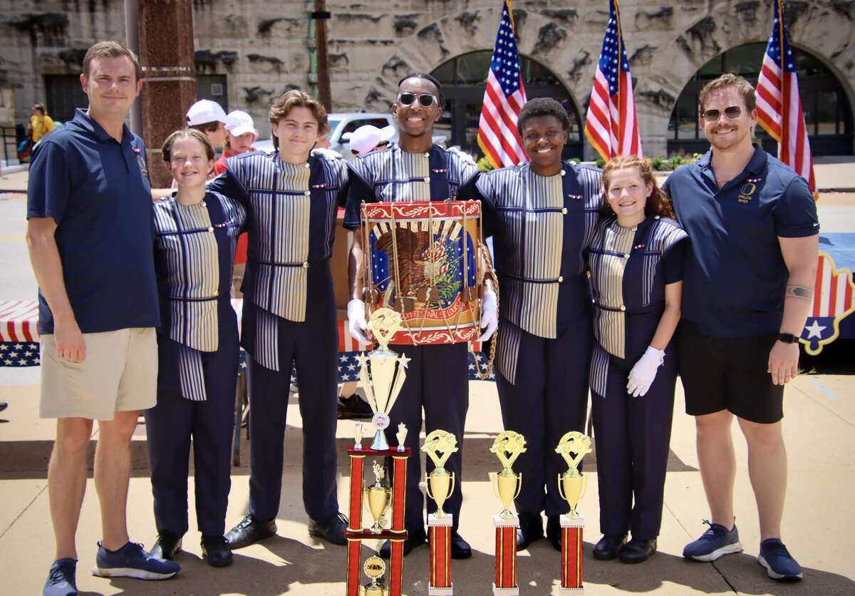 OTHS Marching Panthers representatives accept awards at July 4th America’s Birthday Parade in downtown St. Louis.