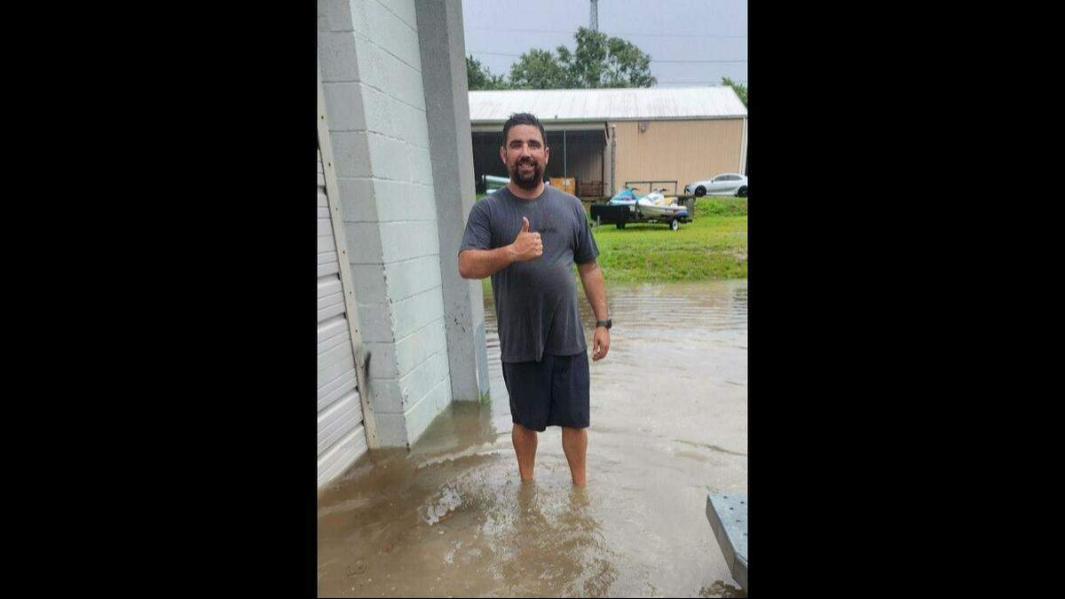 Daniel Green gives the thumbs up in front of his jet skis on July 16, 2024. When Green started riding the jet skis, the police got called to his property.