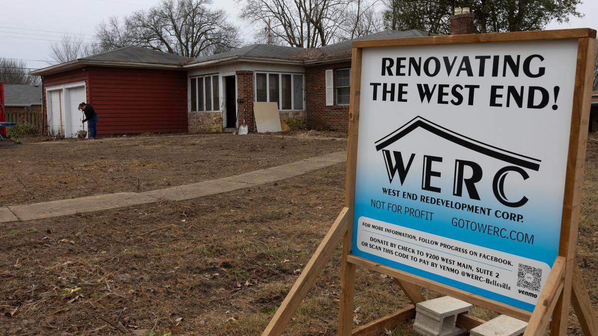 Contractors and volunteers with West End Redevelopment Corp. removed overgrown trees and bushes from property at 300 S. 74th St. in Belleville, where a mid-century modern brick ranch was barely visible before.