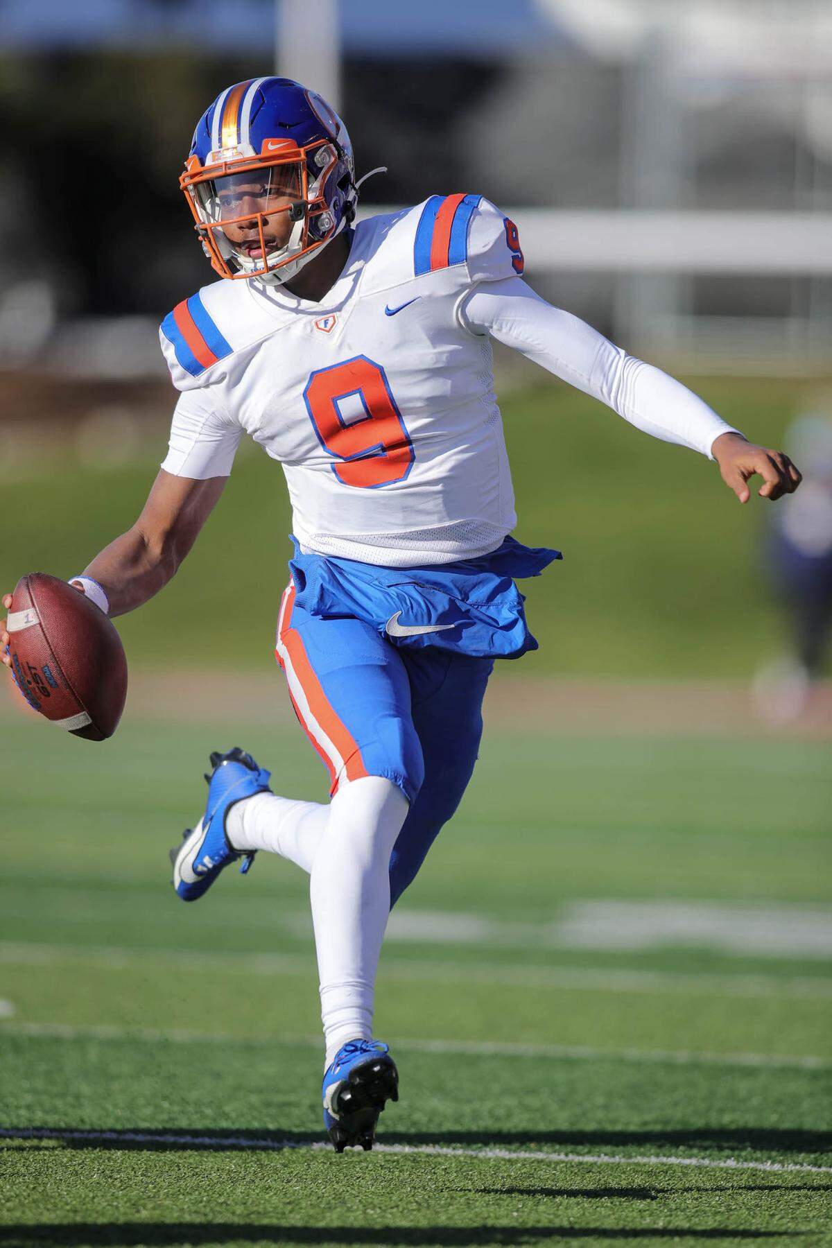 November 25, 2023 - Normal, IL - East St.Louis quarterback Robert “Pops” Battle (9) scrambles while looking for an open receiver during SaturdayÕs IHSA 6A, State Championship game between East St. Louis and Cary (Grove) on the campus of Illinois State University. [Photo: Chris Johns]