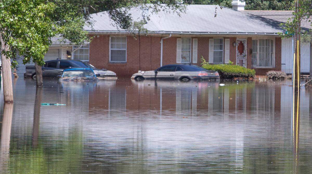 Flood water was slowly receding the afternoon of July 29 on Terrace Drive in East St. Louis after heavy rainfall hit the region July 26. In his latest column, Terry Mackin recalls memories of the flooding he and his family experienced growing up in his childhood home on Terrace Drive.