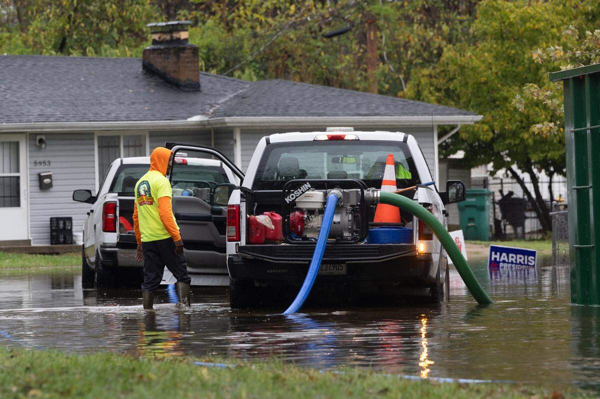 Cahokia Heights city workers pump water off of flooded streets on Nov. 5, 2024.