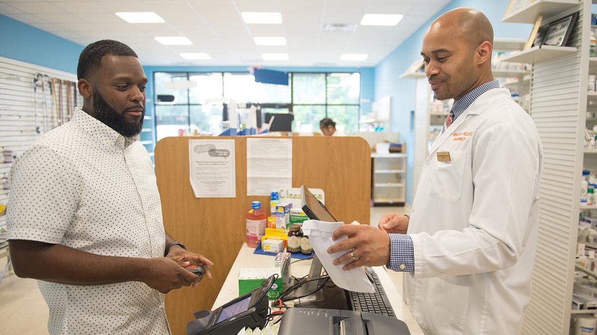 Bernard Macon picks up his prescription on June 6, 2019, at LV Health and Wellness Pharmacy in Shiloh, Ill. (Michael B. Thomas for Kaiser Health News)