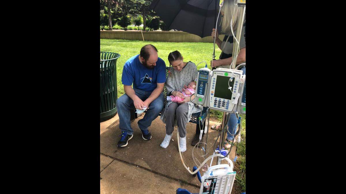 Alex and Stephanie Stroh, of rural O’Fallon, spend time with their baby daughter, Delaney, after Stephanie’s double lung transplant at Barnes-Jewish Hospital in St. Louis.