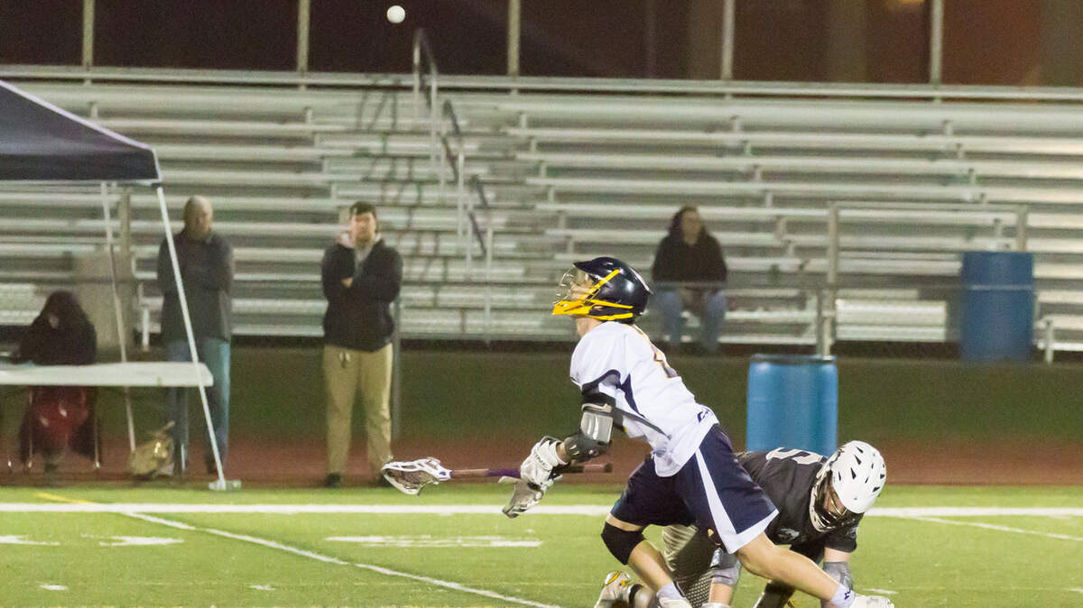 Braden Gaab (2) pops the ball out during a face-off in O'Fallon's match with Belleville.