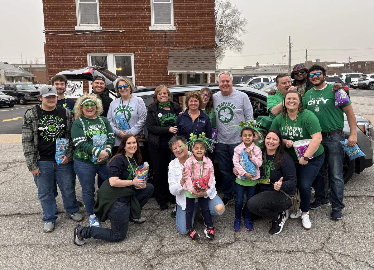 Belleville City Clerk Jenny Gain Meyer, center, wearing navy jacket with city logo, poses with supporters, including Illinois Rep. Jay Hoffman, to her right, during the city’s St. Patrick’s Day festivities on March 15. Meyer is running for mayor.