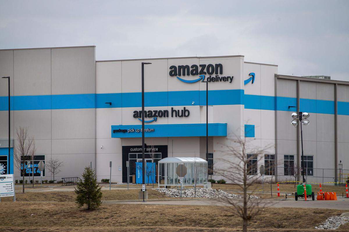 An Amazon warehouse in Edwardsville was the backdrop for a rally of co-workers and family members of six people who died in a tornado that hit one of the company’s facilities on Dec. 10.