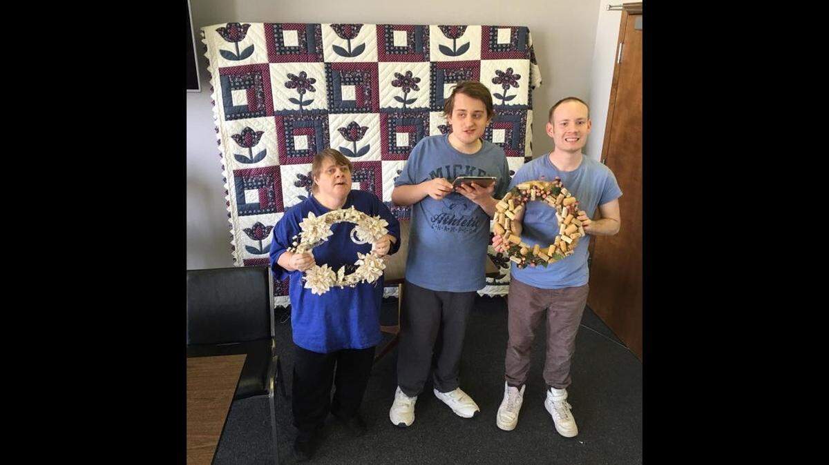 Residents of Warren G. Murray Developmental Center in Centralia are shown in a Facebook photo advertising a quilt and wreath raffle for Murray Parents Association in March.