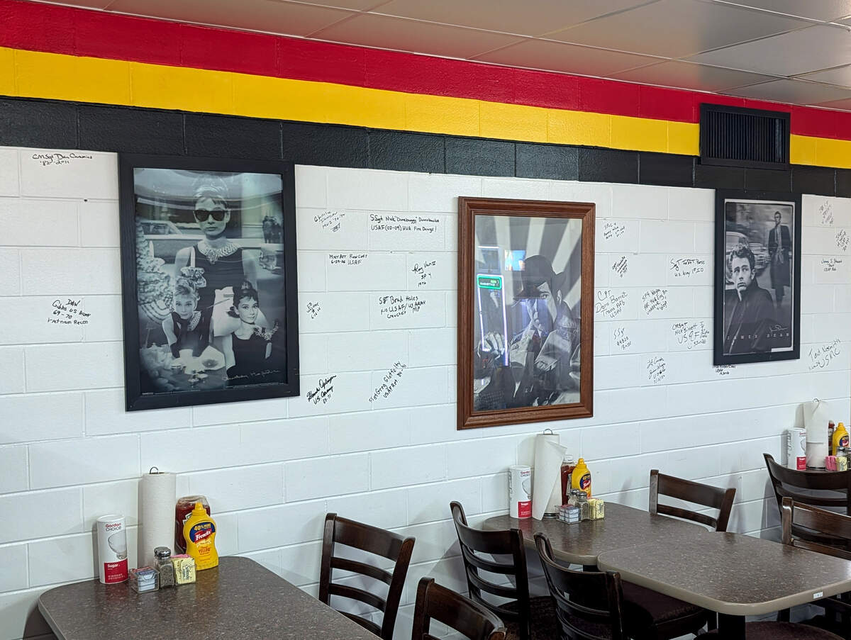 The colors, 1950s theme, and signatures on the wall are all significant at veteran-owned Rockin' Robyn's Diner.