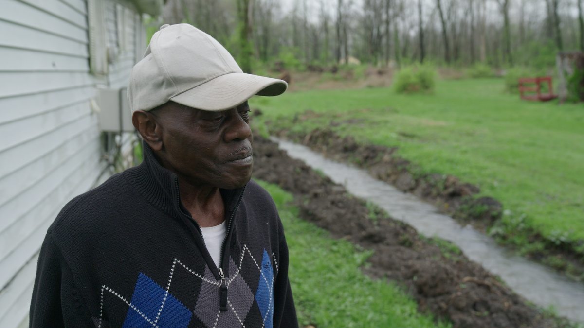 William McNeal, 73, says he doesn’t trust the water at his home in Cahokia Heights, where a ditch surrounding his house flows with smelly water every time there is significant rain.