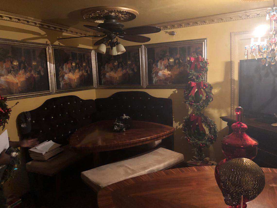 Gloria Elam said she decorated all of 40 Jarvis Place herself, including this living room with paintings and booths.
