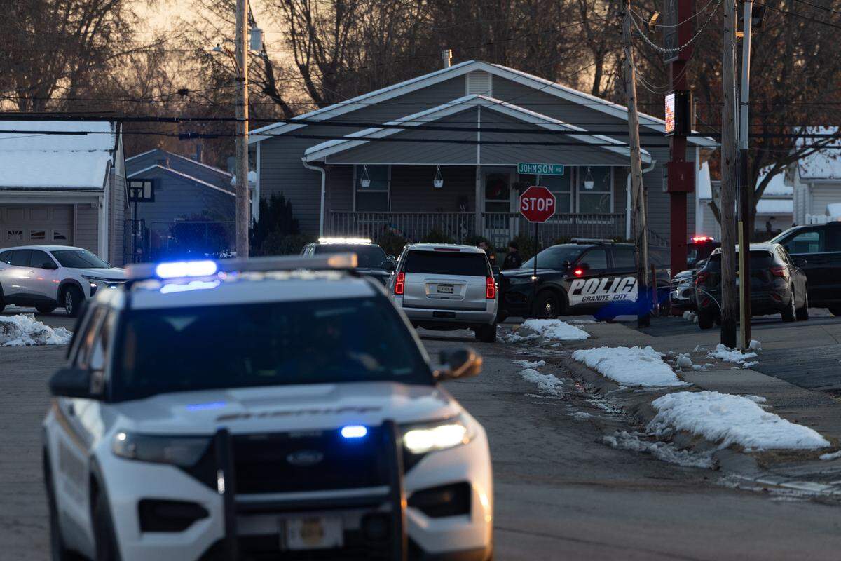 The scene along Granite City’s Johnson St., which police officers closed down after multiple reports that a fellow officer was shot.