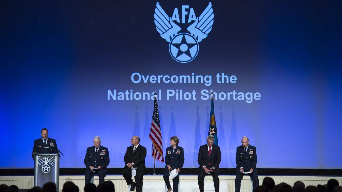 Gen. James M. Holmes, Air Combat Command commander, Gen. Maryanne Miller, Air Mobility Command commander, Lt. Gen. L. Scott Rice, Air National Guard director, Gene Colabatistto, CAE defense and security group president, and Jim Graham, Delta Air Lines flight operations senior vice president, discuss overcoming the national pilot shortage during the Air Force Association’s Air, Space and Cyber Conference in National Harbor, Md., on Sept. 18.