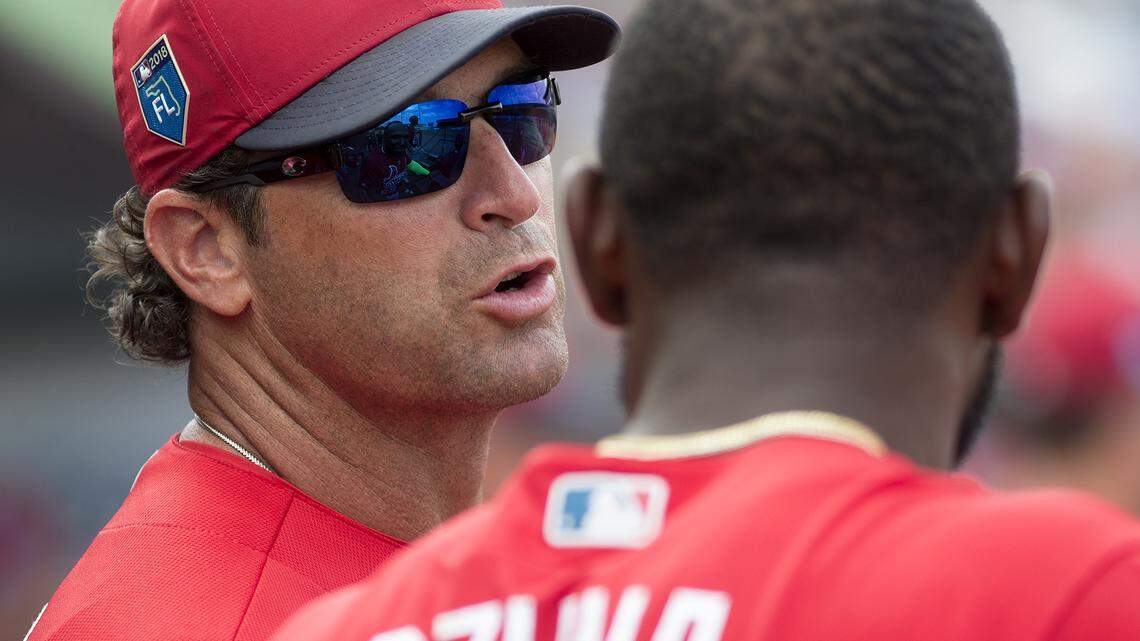 Cardinals manager Mike Matheny talks with Marcell Ozuna, his new left fielder and cleanup hitter, during a game at Roger Dean Stadium in Jupiter, Florida.