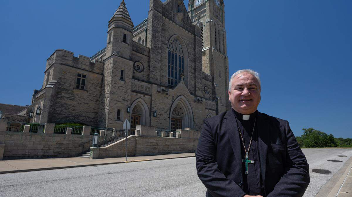 Bishop Michael McGovern of the Diocese of Belleville stands before the Cathedral of St. Peter in Belleville, Ill., on June 24, 2024.