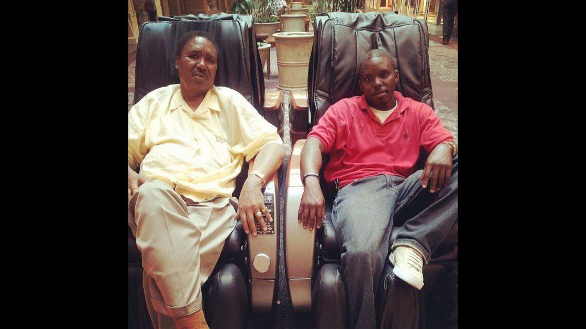 Rev. Johnny Scott with his grandson Jamail Watson.
