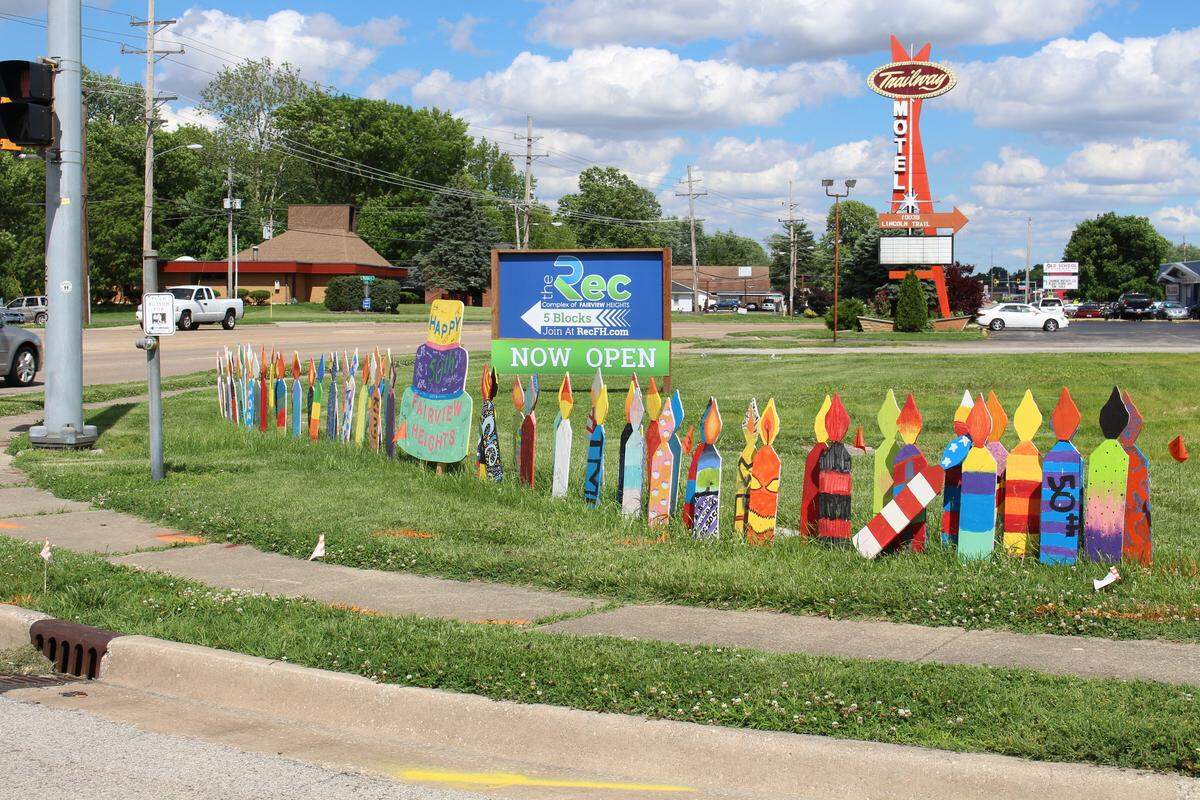 Fairview Heights businesses and organizations decorated 50 wooden birthday cakes that are being displayed throughout the city as part of its 50th anniversary celebration. Students at Grant School put candles around their cake at the intersection of Lincoln Trail and Bunkum Road.