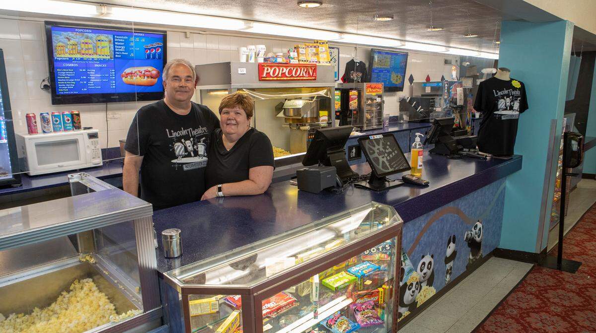 Dave and Sandy Schoenborn, who own the Lincoln Theatre in Belleville, pose at the concession stand. Sandy’s father, the late Richard Wright, bought the business in 1980 and ran it with his wife, Betty.