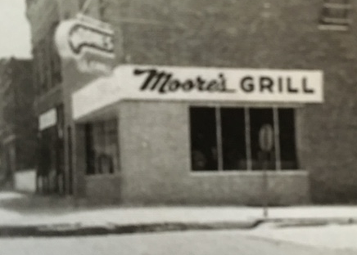 This grainy black-and-white photo shows Moore’s Grill in East St. Louis in the 1950s. It was operated by William “Red” Moore.
