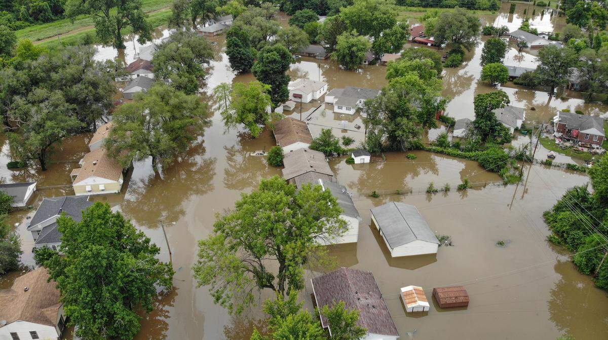 Homes and vehicles on Terrace Drive and Mary Avenue in East St. Louis were flooded during a storm on Tuesday.