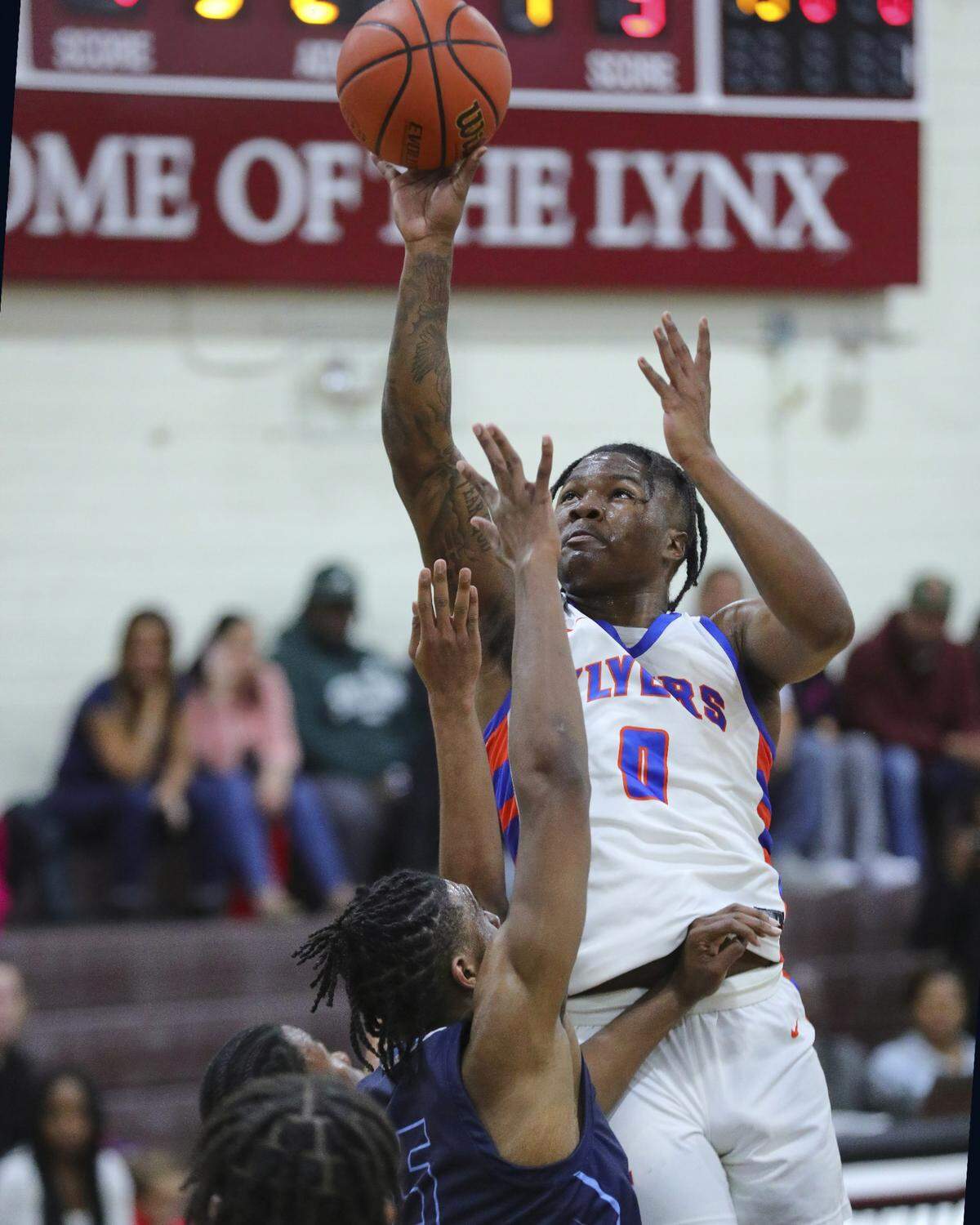 East St. Louis guard Macaleab Rich drives to the basket during Tuesday night’s Southwestern Conference game against Belleville East. The Flyers ultimately posted a 72-71 victory.