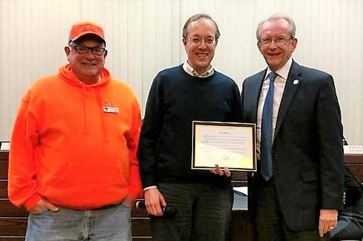 William Holden Day Proclamation: From left, Tom Schwarztrauber and Brian Keller, president of the O’Fallon Historical Society, with Mayor Herb Roach in spring 2018. This Saturday, Jan. 28, the local historian, icon and official photographer of all things O’Fallon is being celebrated with Brian Keller Day.