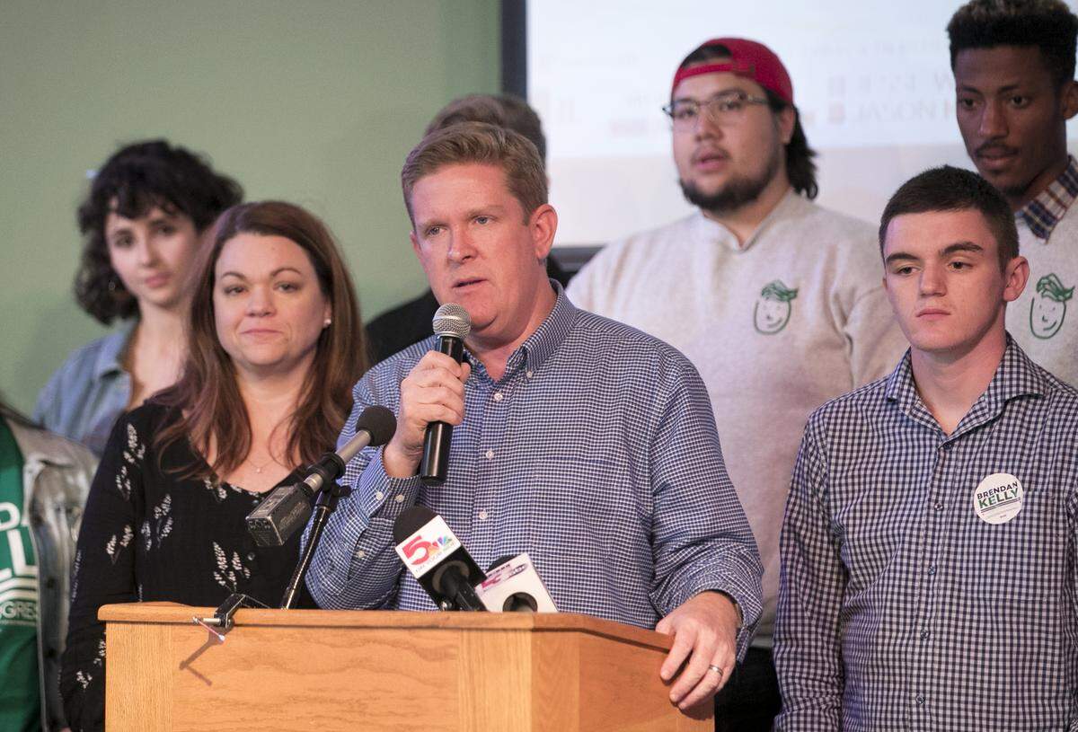 Surrounded by his campaign team and family, Brendan Kelly concedes to Mike Bost in the Illinois 12th congressional district race.