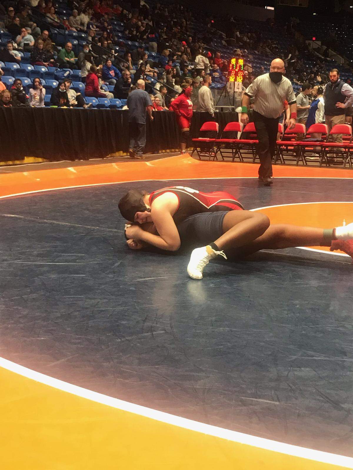Highland freshman 170-pound wrestler August Rottmann works to pin Oak Park-River Forest’s Tiffany White during a consolation semifinal match Saturday, Feb. 26, in the IHSA girls tournament at Grossinger Motors Arena in Bloomington. Rottmann ultimately captured third place in the 170-pound class of the inaugural IHSA individual girls state tournament.